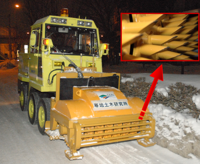 click to enlarge Photo 2 The developed machine attached to a small snow removal vehicle