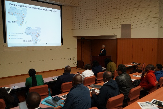 The Executive Director Koike delivering a lecture