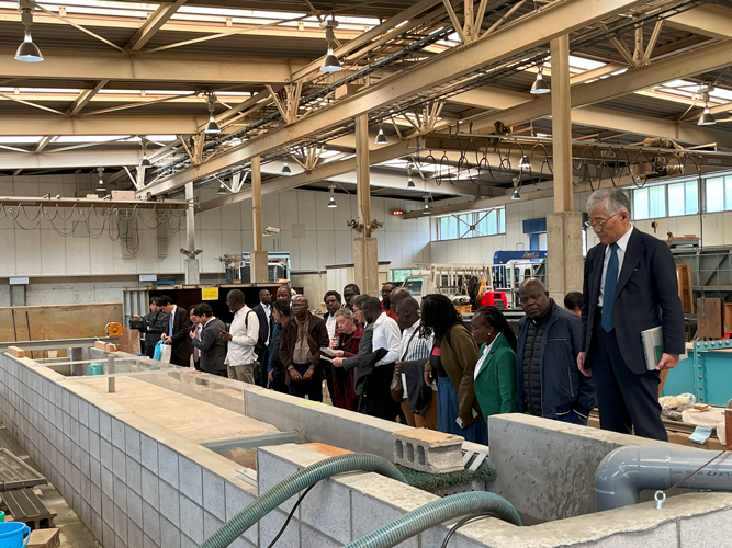 The participants touring an experimental facility